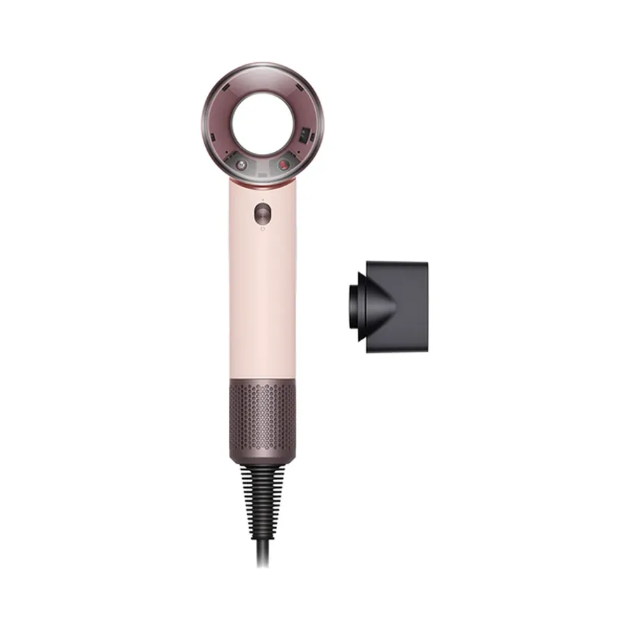 Supersonic Travel dryer in ceramic pink and rose gold next to its black styling concentrator